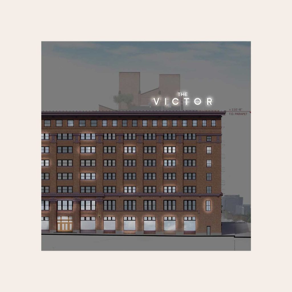The Victor residential development branding on the exterior of the building